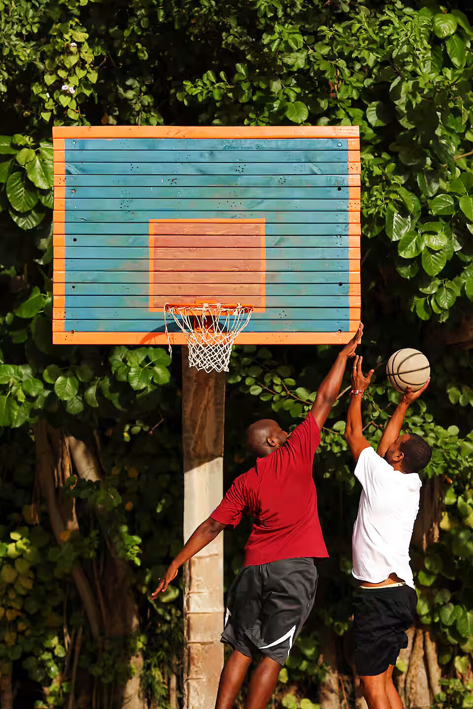 3-on-3 basketball under the colorful Alamar backboard