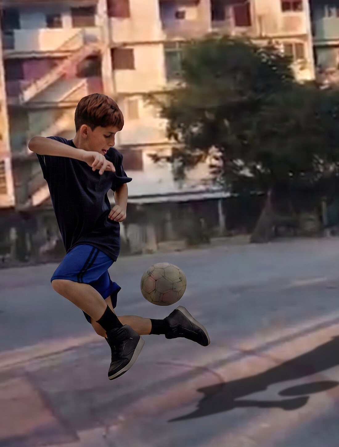 Playing soccer in a Havana street